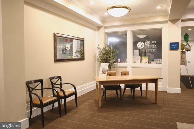 a view of hallway with a hallway and a chandelier