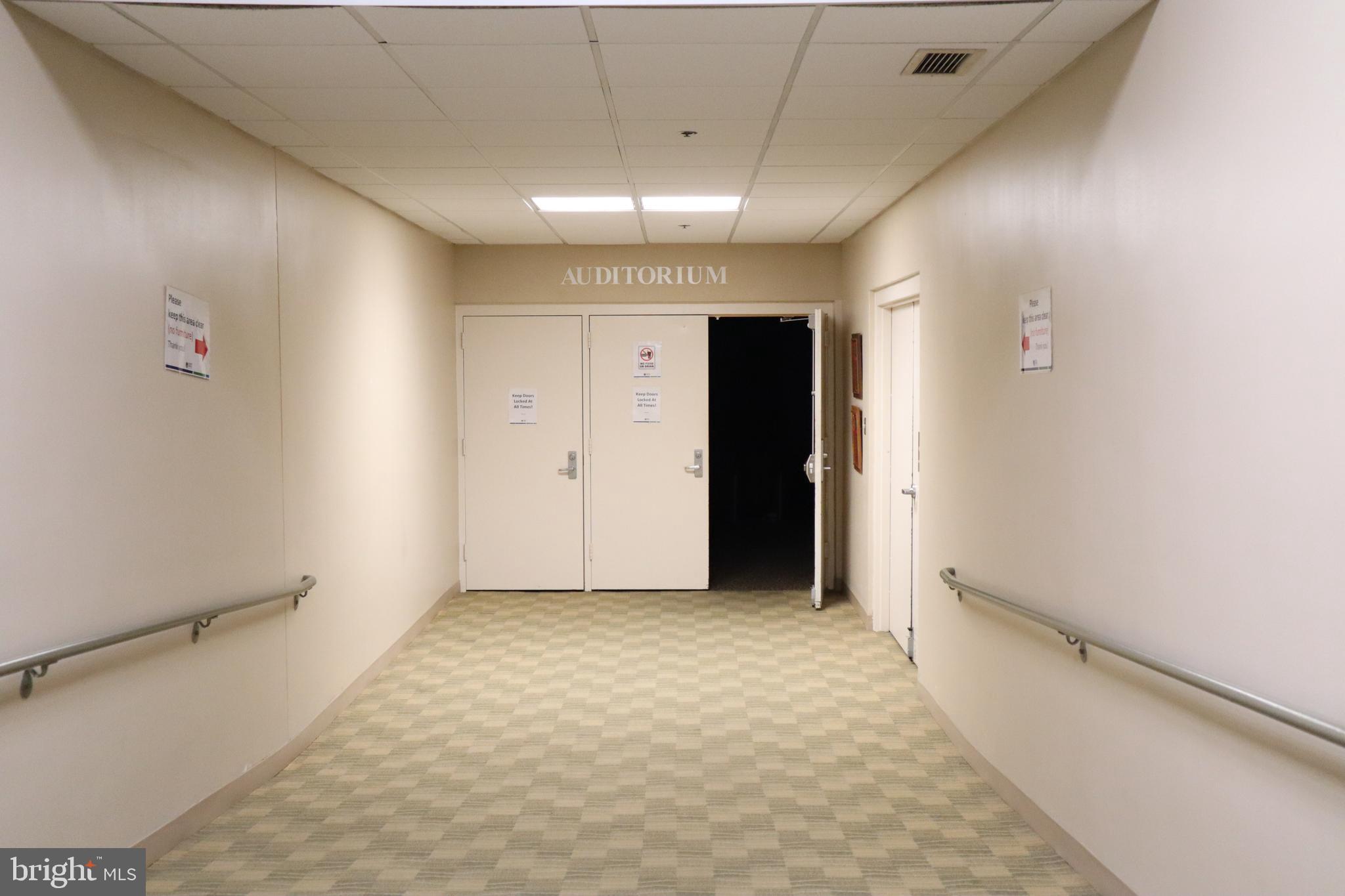 15107 Interlachen Drive, Unit 2119 Silver Spring, MD 20906 - Photo 31 of 53 a view of hallway with a hallway and a chandelier