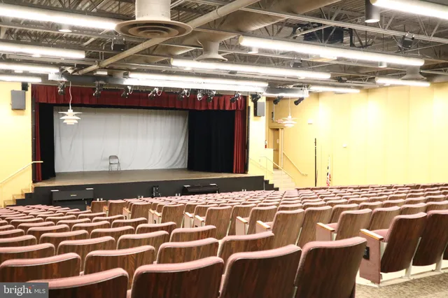 a view of a hall way with furniture