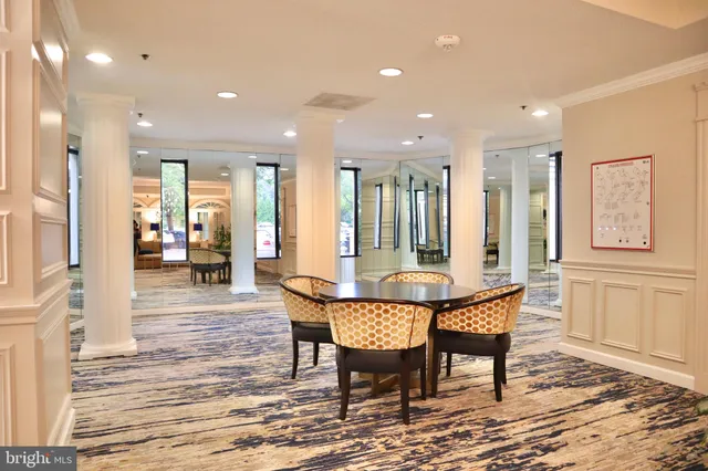 a view of living room with furniture and a chandelier