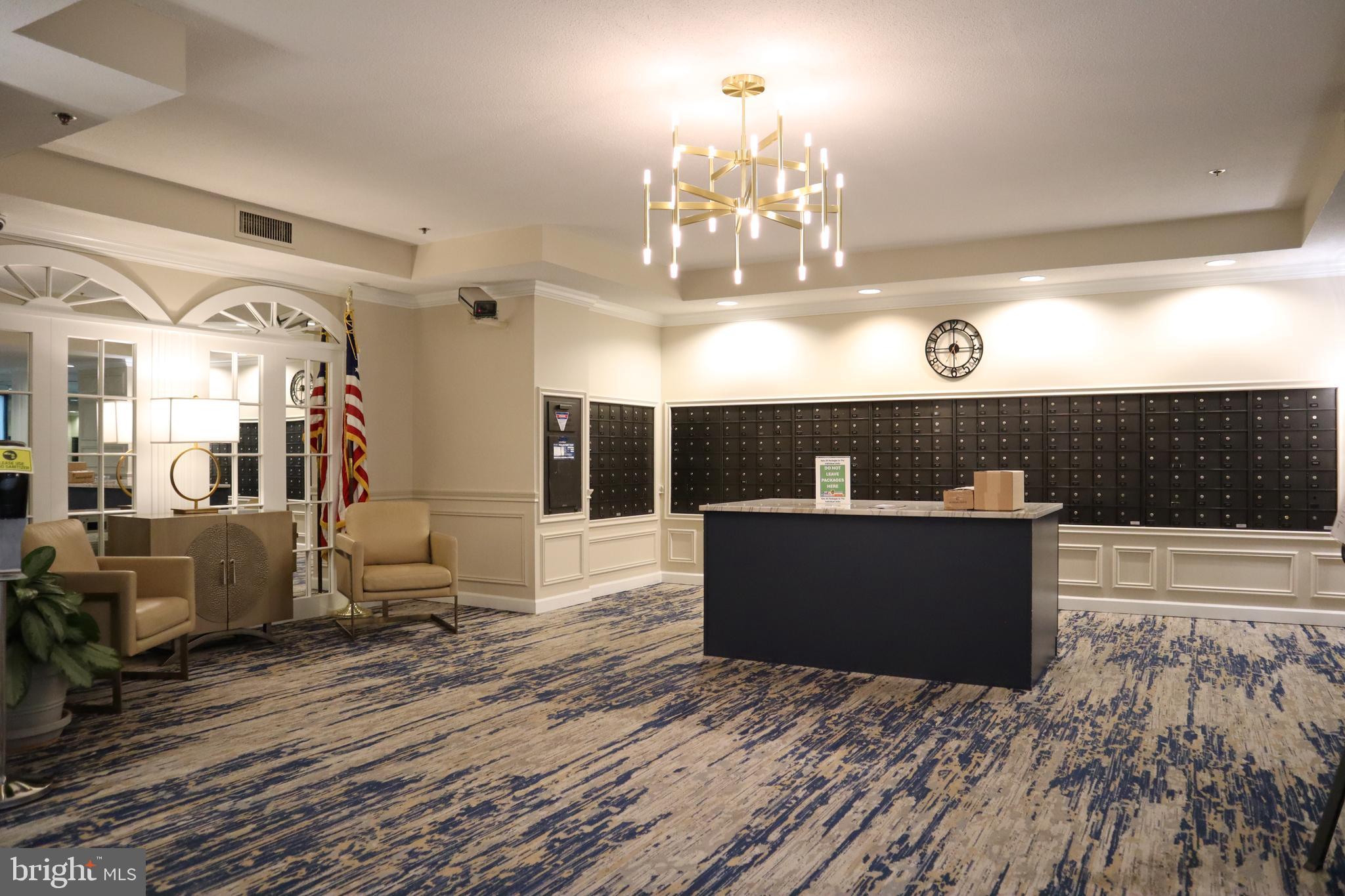 15107 Interlachen Drive, Unit 2119 Silver Spring, MD 20906 - Photo 9 of 53 a view of living room with furniture and a chandelier