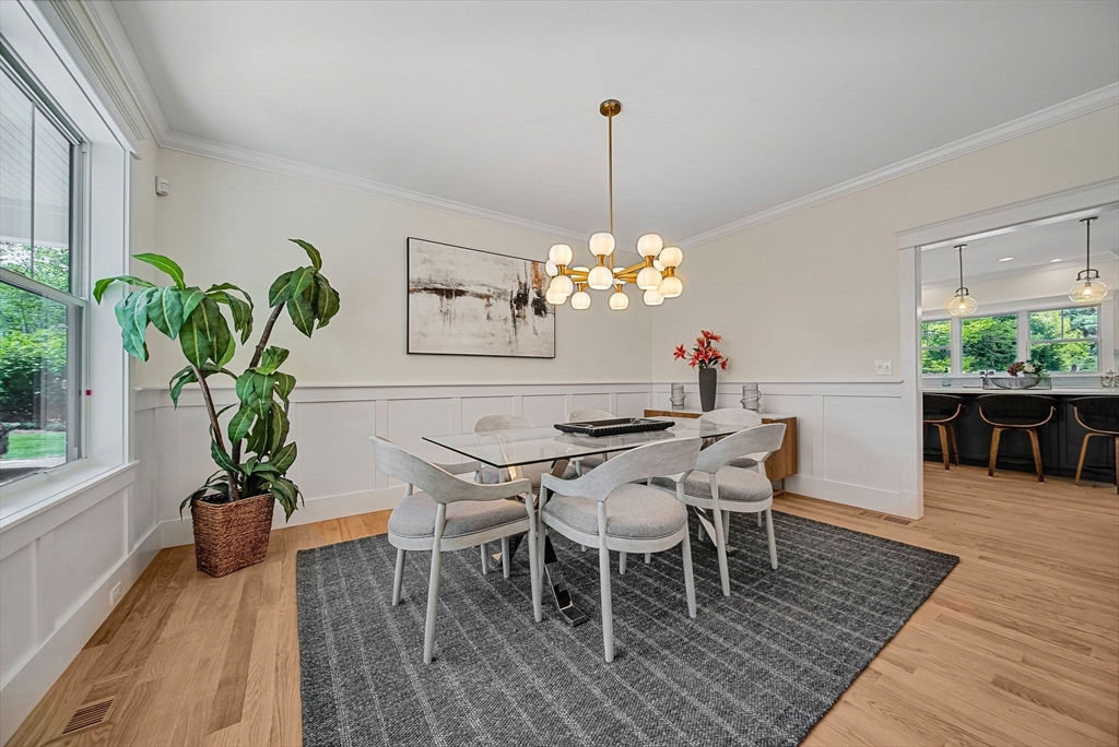 120 Lawton Road Needham, MA 02492 - Photo 11 of 34 a dining room filled chandelier and wooden floor