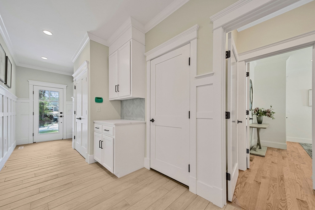 120 Lawton Road Needham, MA 02492 - Photo 15 of 34 a large white kitchen with white cabinets