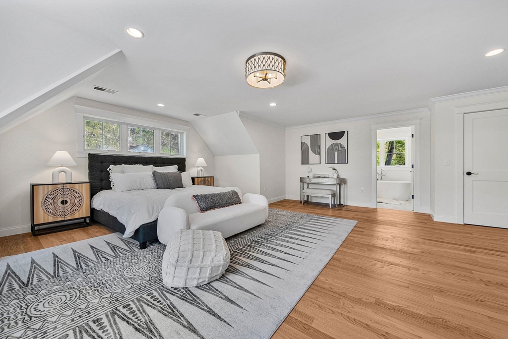 120 Lawton Road Needham, MA 02492 - Photo 16 of 34 a bedroom with a bed and wooden floor
