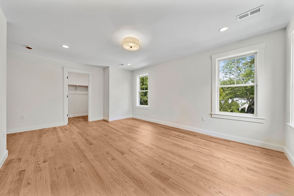 120 Lawton Road Needham, MA 02492 - Photo 21 of 34 an empty room with wooden floor and windows