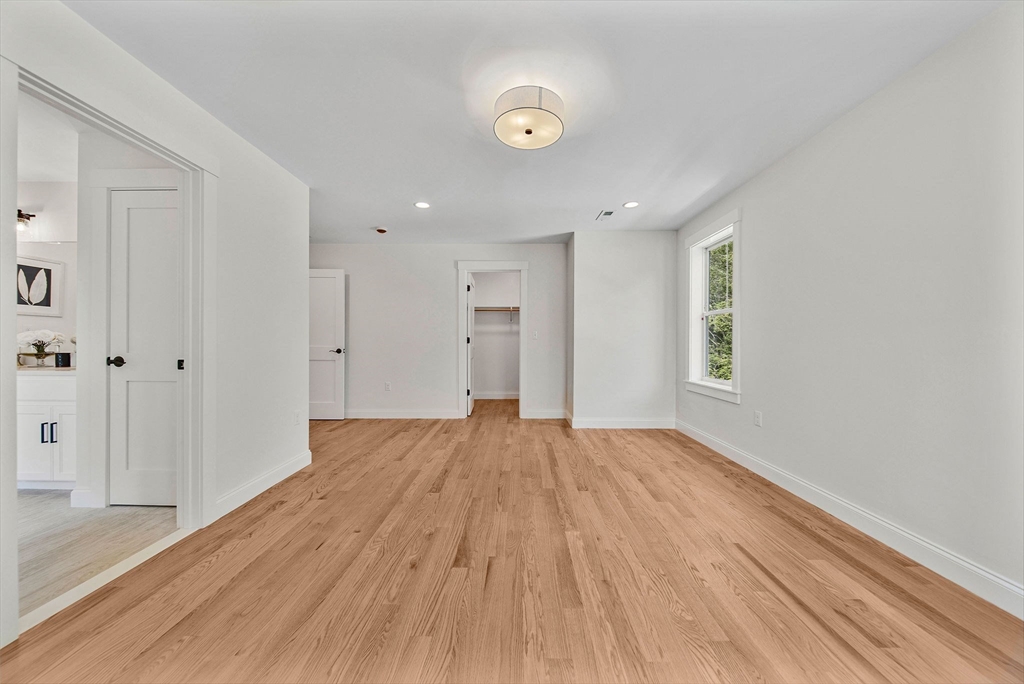 120 Lawton Road Needham, MA 02492 - Photo 22 of 34 a view of an empty room with wooden floor and a window
