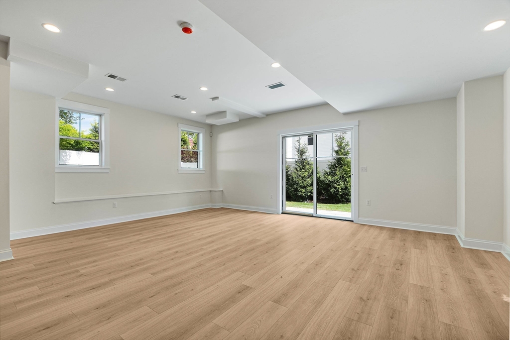 120 Lawton Road Needham, MA 02492 - Photo 29 of 34 a view of an empty room with wooden floor and a window