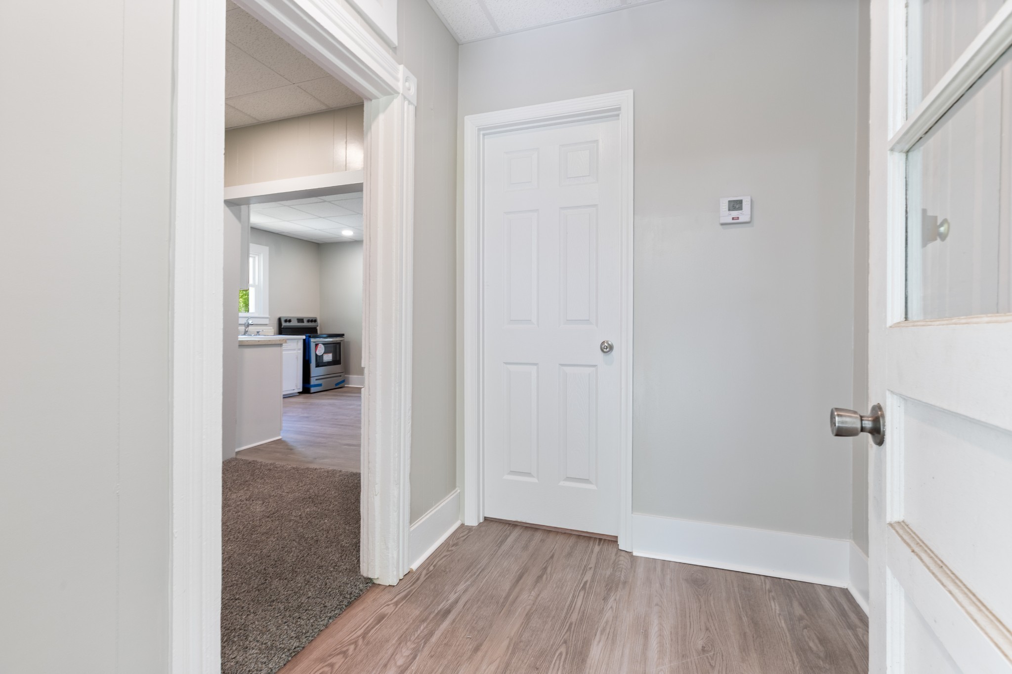 300 West Railroad Street Dickson, TN 37055 - Photo 14 of 58 a view of a hallway with wooden floor and a bathroom