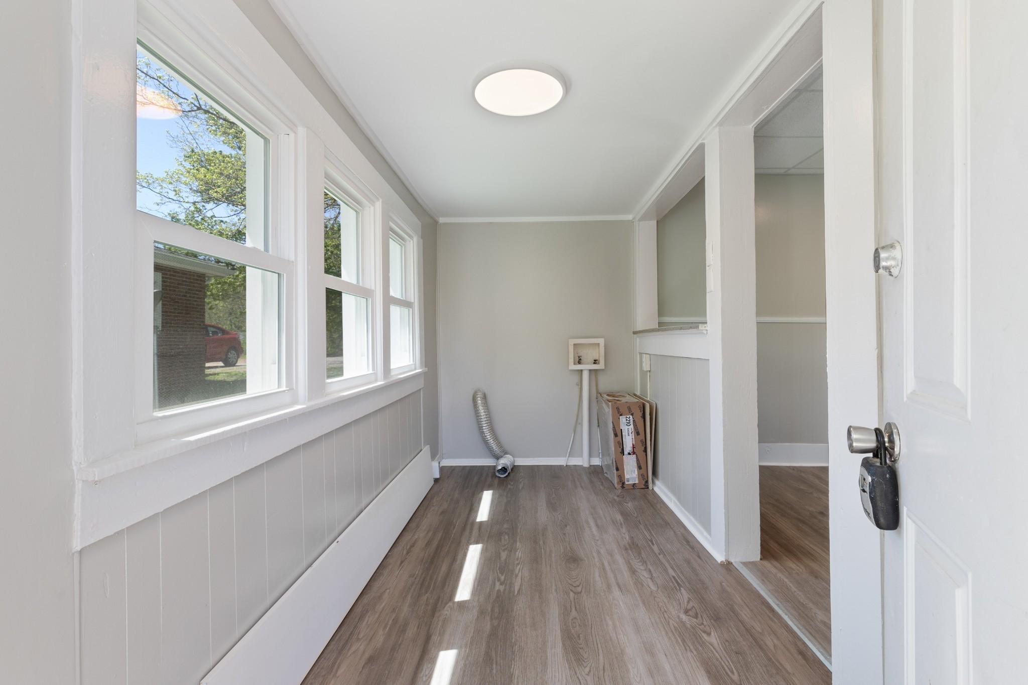 300 West Railroad Street Dickson, TN 37055 - Photo 26 of 58 a view of hallway with a large window and wooden floor