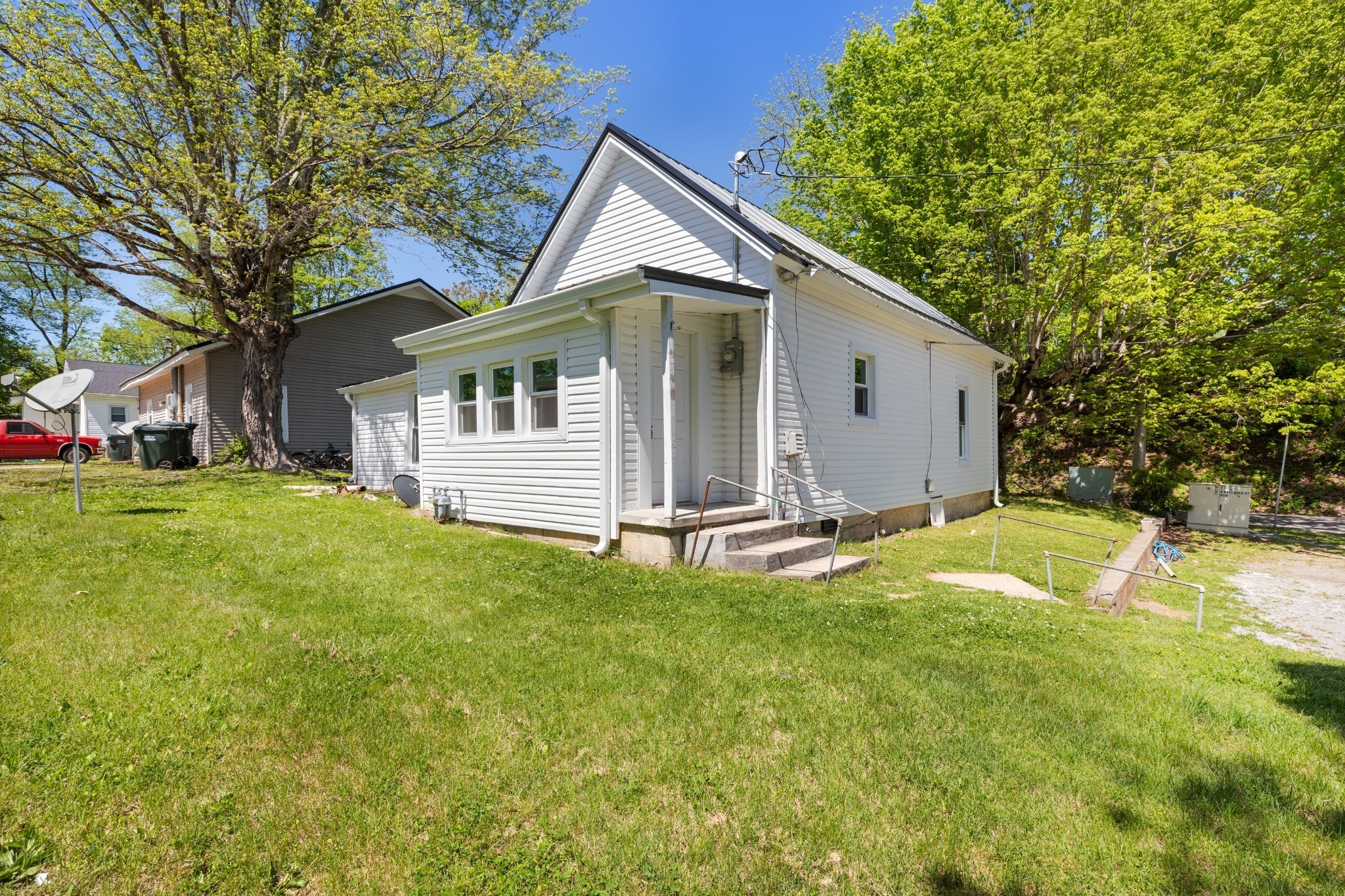 300 West Railroad Street Dickson, TN 37055 - Photo 28 of 58 a view of a house with a backyard and a tree