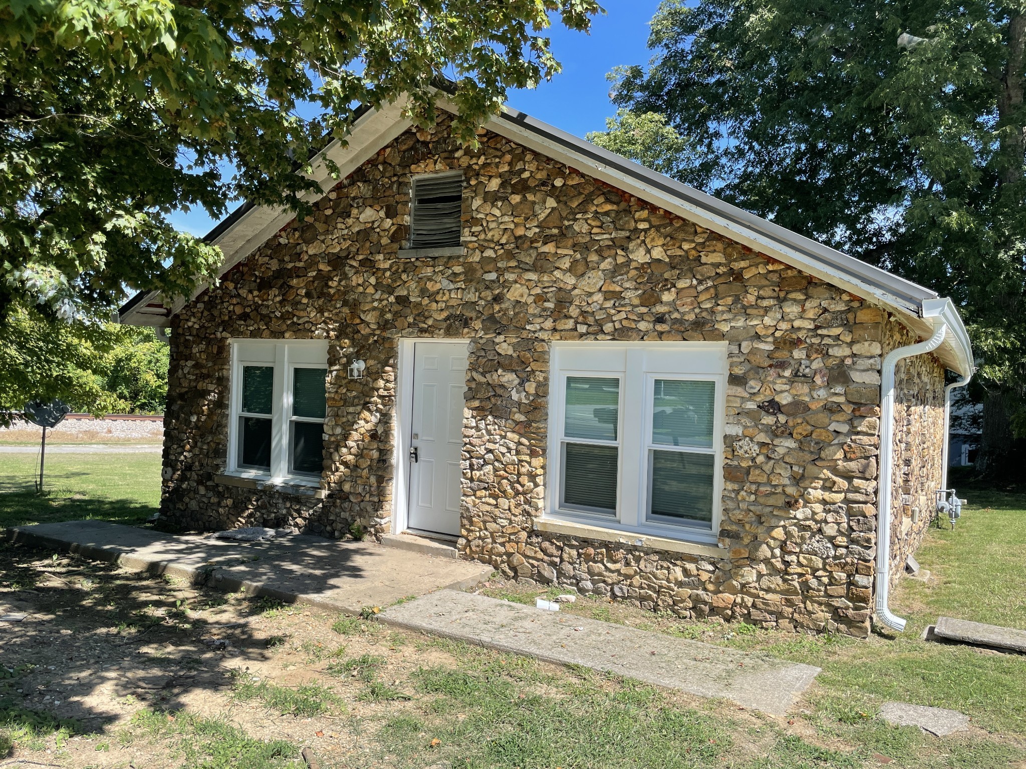 300 West Railroad Street Dickson, TN 37055 - Photo 33 of 58 a front view of a house with a yard