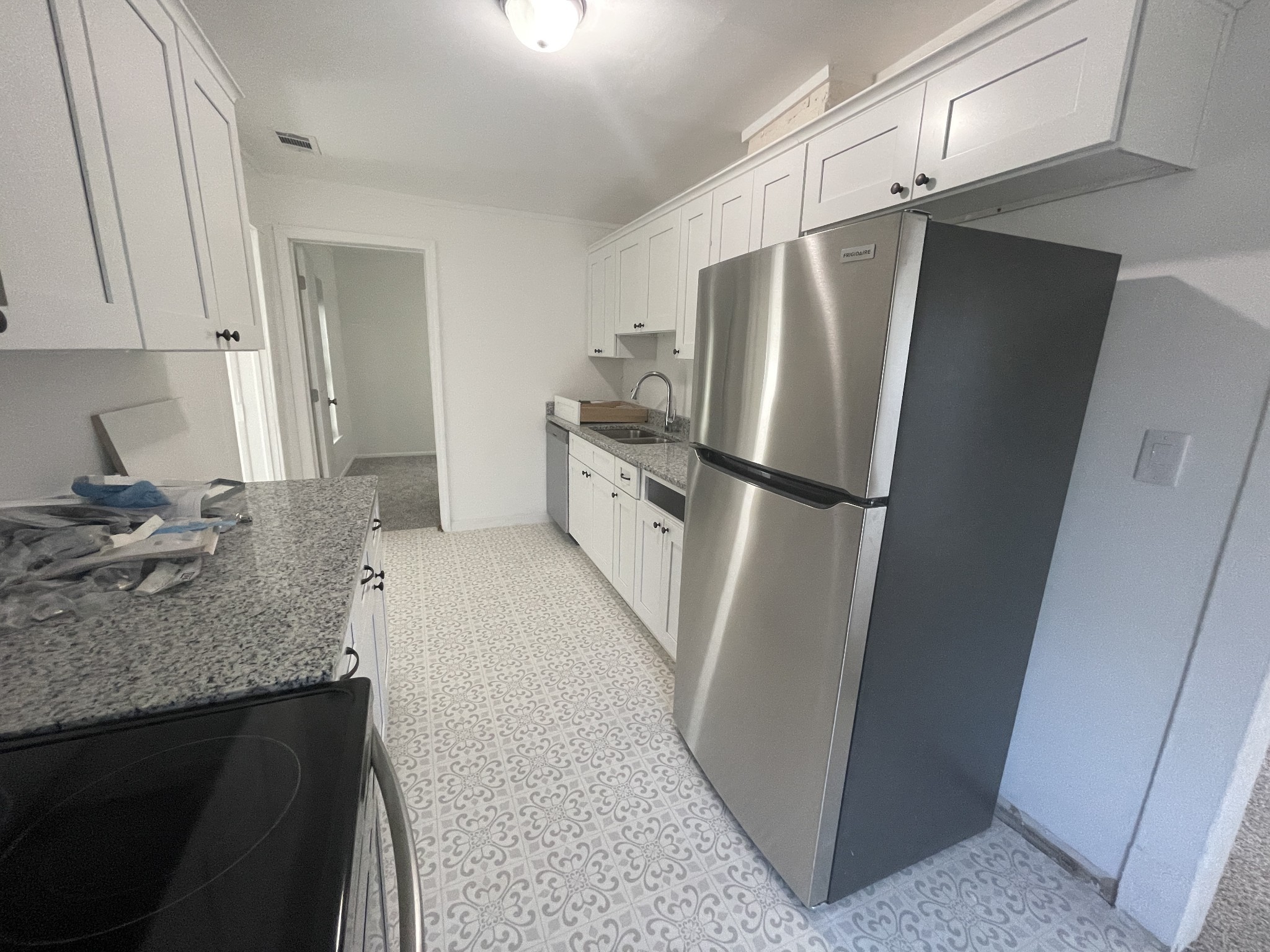 300 West Railroad Street Dickson, TN 37055 - Photo 43 of 58 a kitchen with a refrigerator a sink and cabinets
