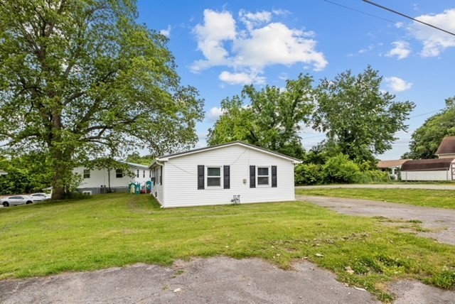 300 West Railroad Street Dickson, TN 37055 - Photo 49 of 58 a view of a house with a yard