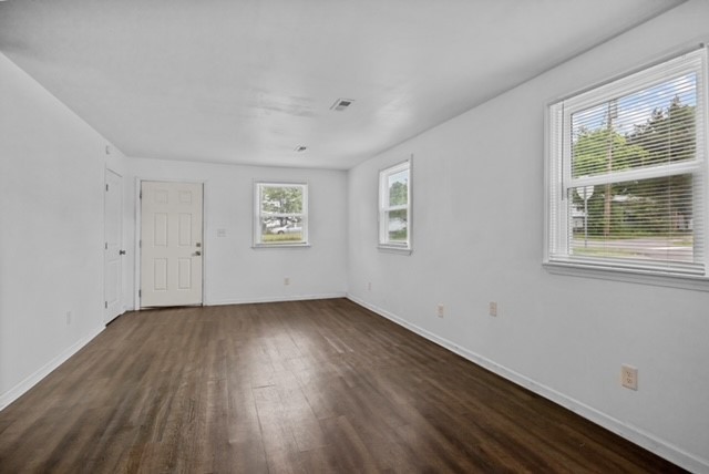 300 West Railroad Street Dickson, TN 37055 - Photo 50 of 58 a view of an empty room with wooden floor and a window