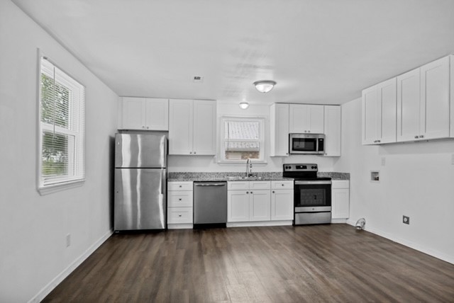 300 West Railroad Street Dickson, TN 37055 - Photo 52 of 58 a kitchen with stainless steel appliances a refrigerator stove microwave and sink
