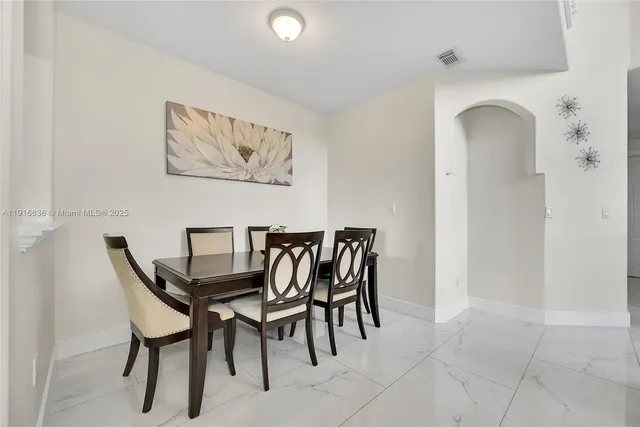 a view of a dining room with furniture