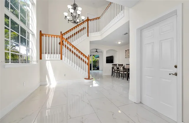 a view of entryway and hall with dining room