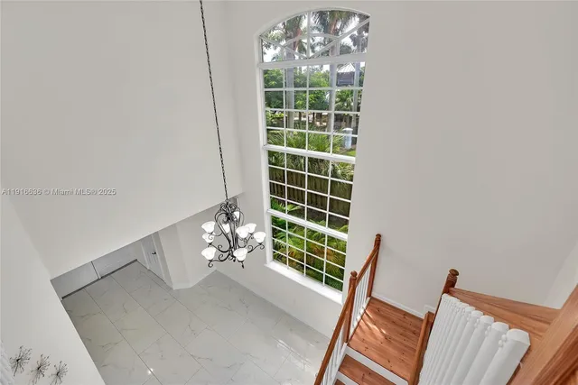 a view of an empty room with windows