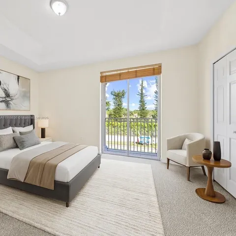 a bedroom with furniture and a window