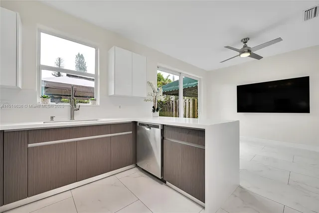a kitchen with a sink and a microwave