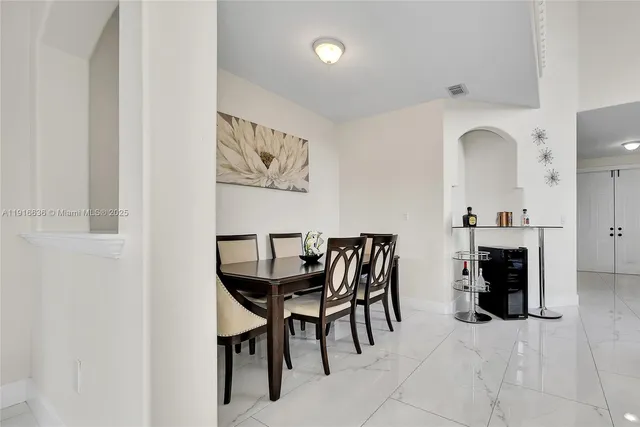 a view of a dining room with furniture