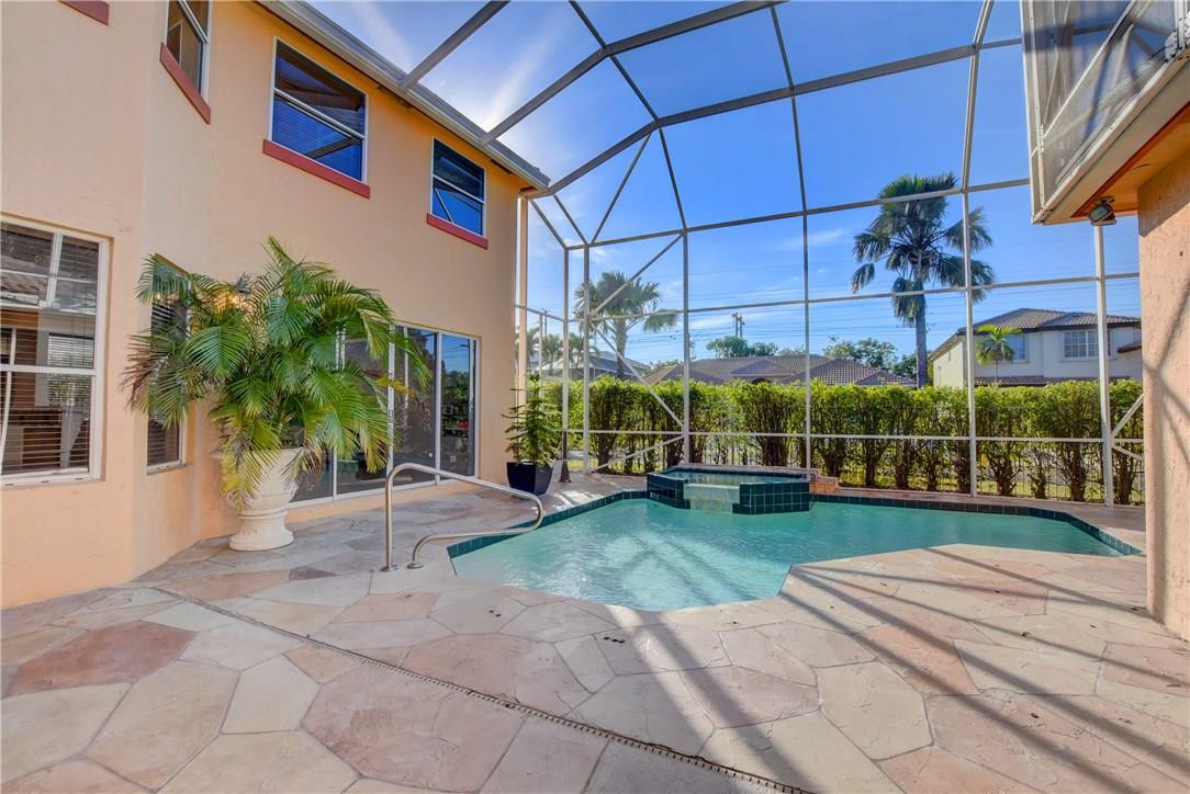 10934 Ravel Court Boca Raton, FL 33498 - Photo 42 of 43 a view of a house with a yard and potted plants