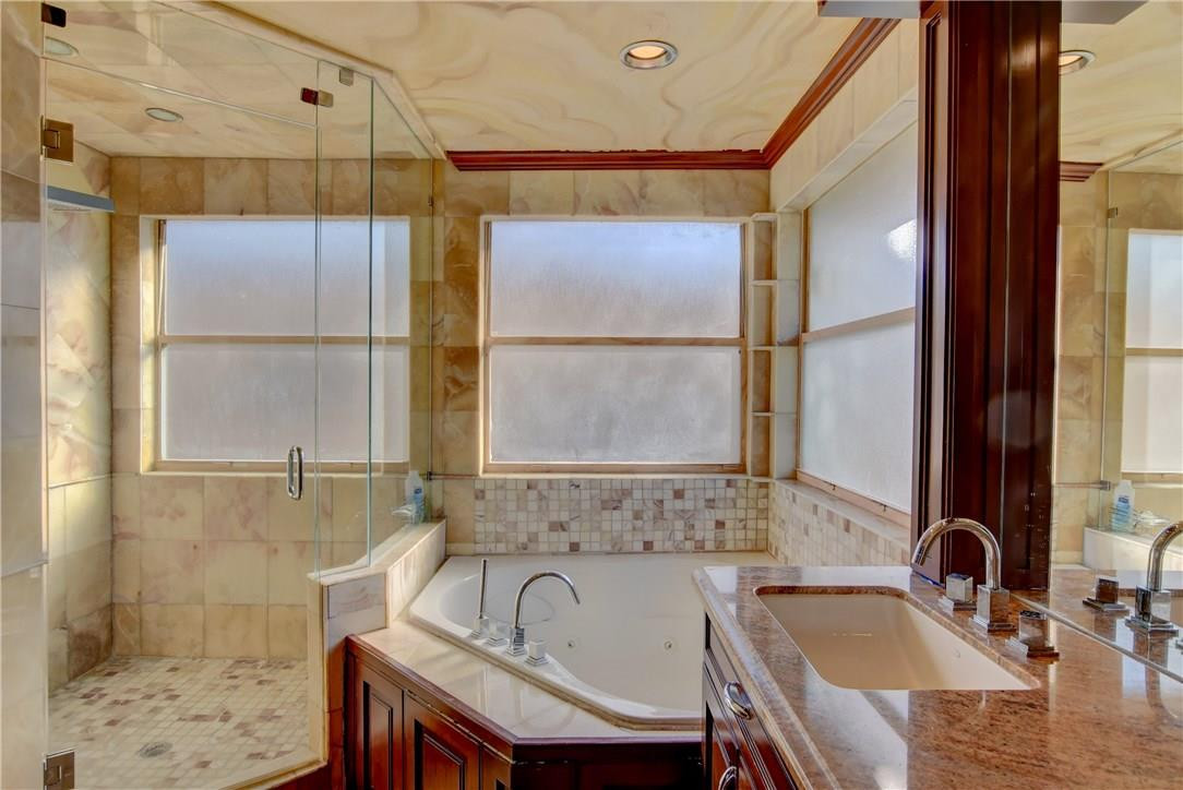 10934 Ravel Court Boca Raton, FL 33498 - Photo 6 of 43 a bathroom with a sink and a bathtub