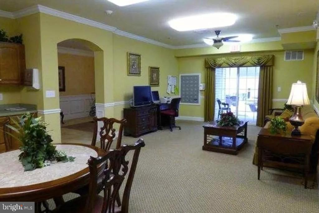 7320 Maple Avenue, Unit 231 Pennsauken, NJ 08109 - Photo 15 of 15 a living room with furniture and a chandelier