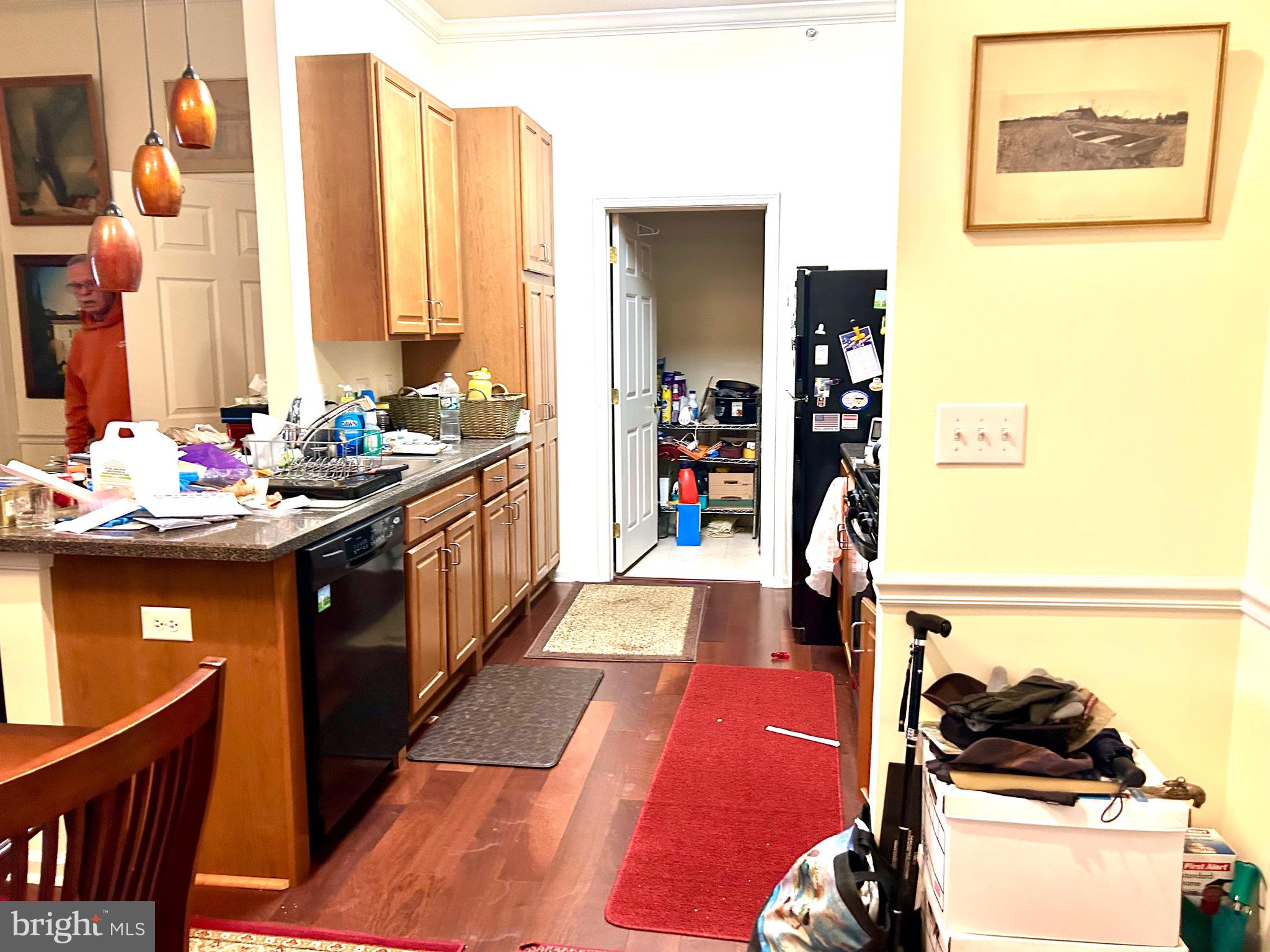 7320 Maple Avenue, Unit 231 Pennsauken, NJ 08109 - Photo 4 of 15 a kitchen with stainless steel appliances kitchen island granite countertop a sink stove and cabinets