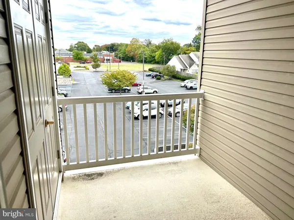 a view of a balcony with wooden floor