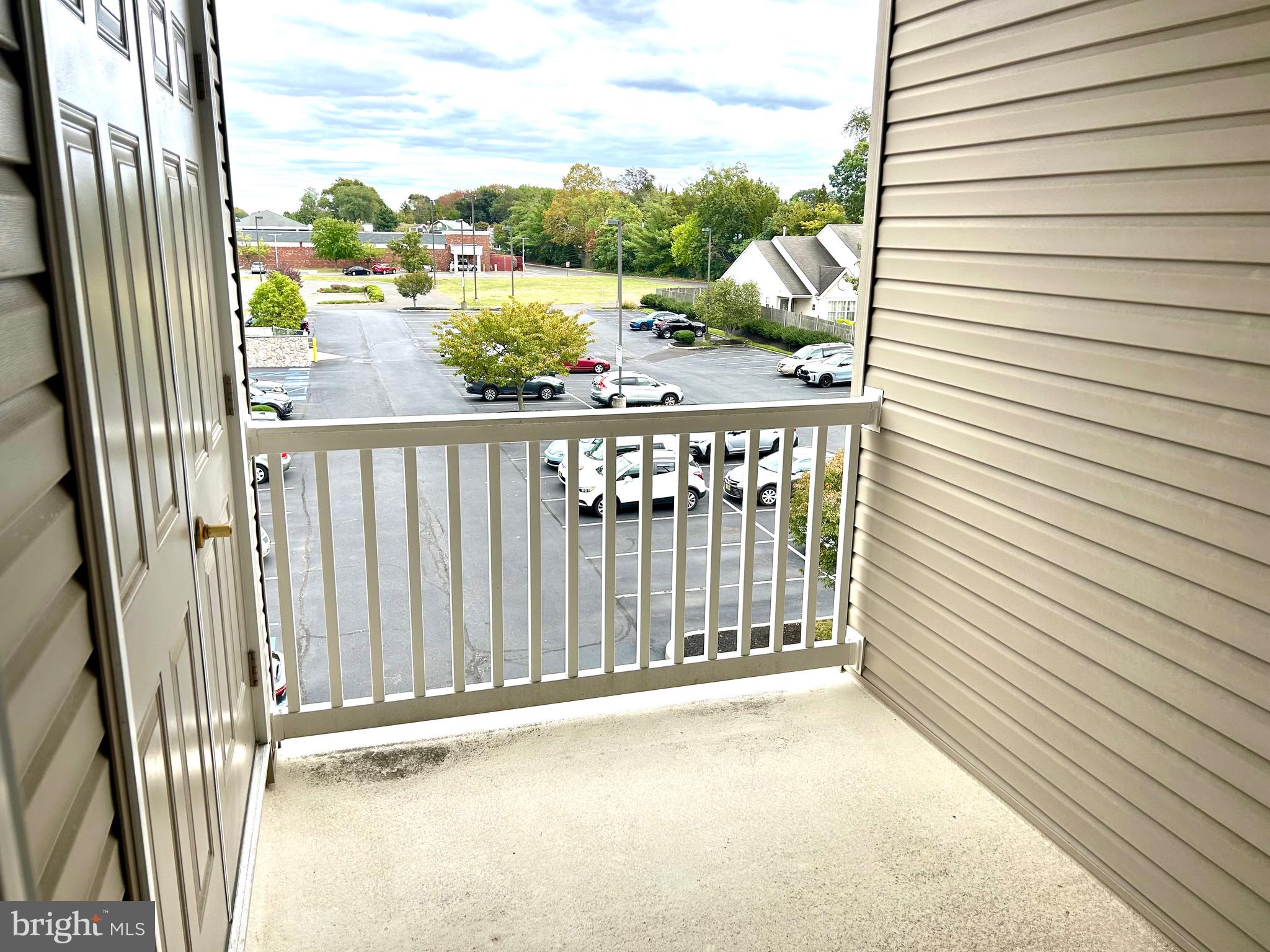 7320 Maple Avenue, Unit 231 Pennsauken, NJ 08109 - Photo 9 of 15 a view of a balcony with wooden floor