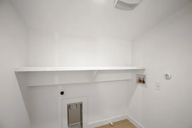 a front view of a house with a patio