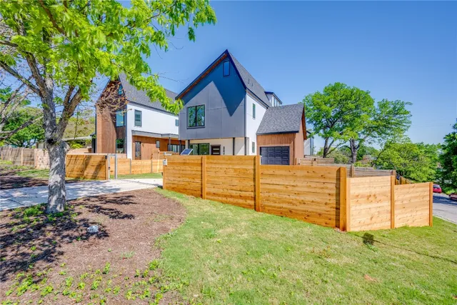 a view of a backyard with a garden and plants