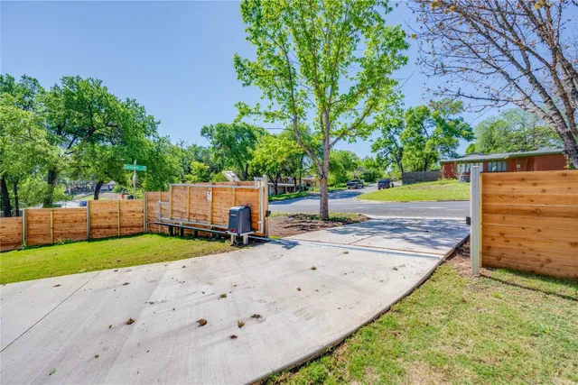 a front view of a house with a yard and glass door