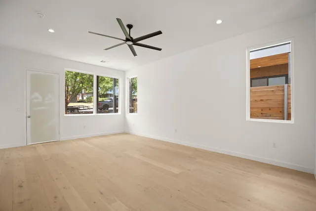 a view of an empty room with a window