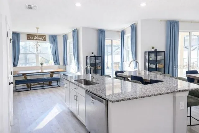 a bathroom with a window and a shower