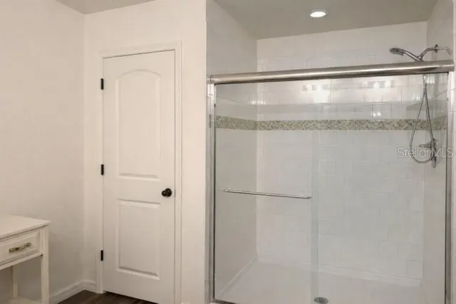 a bedroom with a bed and a cabinets