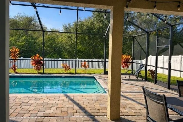 a view of a balcony with yard