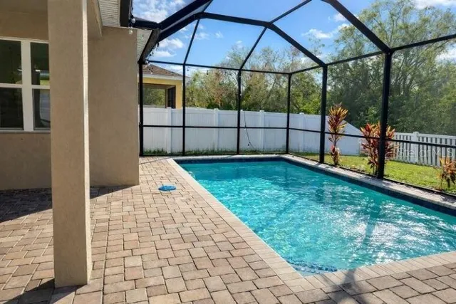 a view of a backyard with sitting area