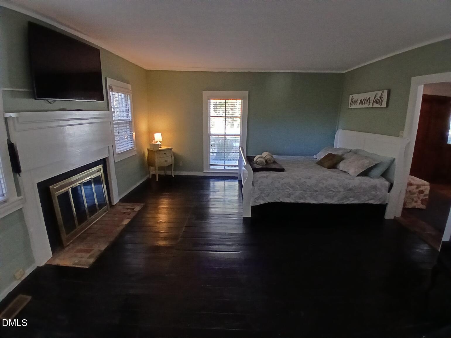 1920 Kelly Road Apex, NC 27502 - Photo 14 of 44 a living room with furniture and a flat screen tv