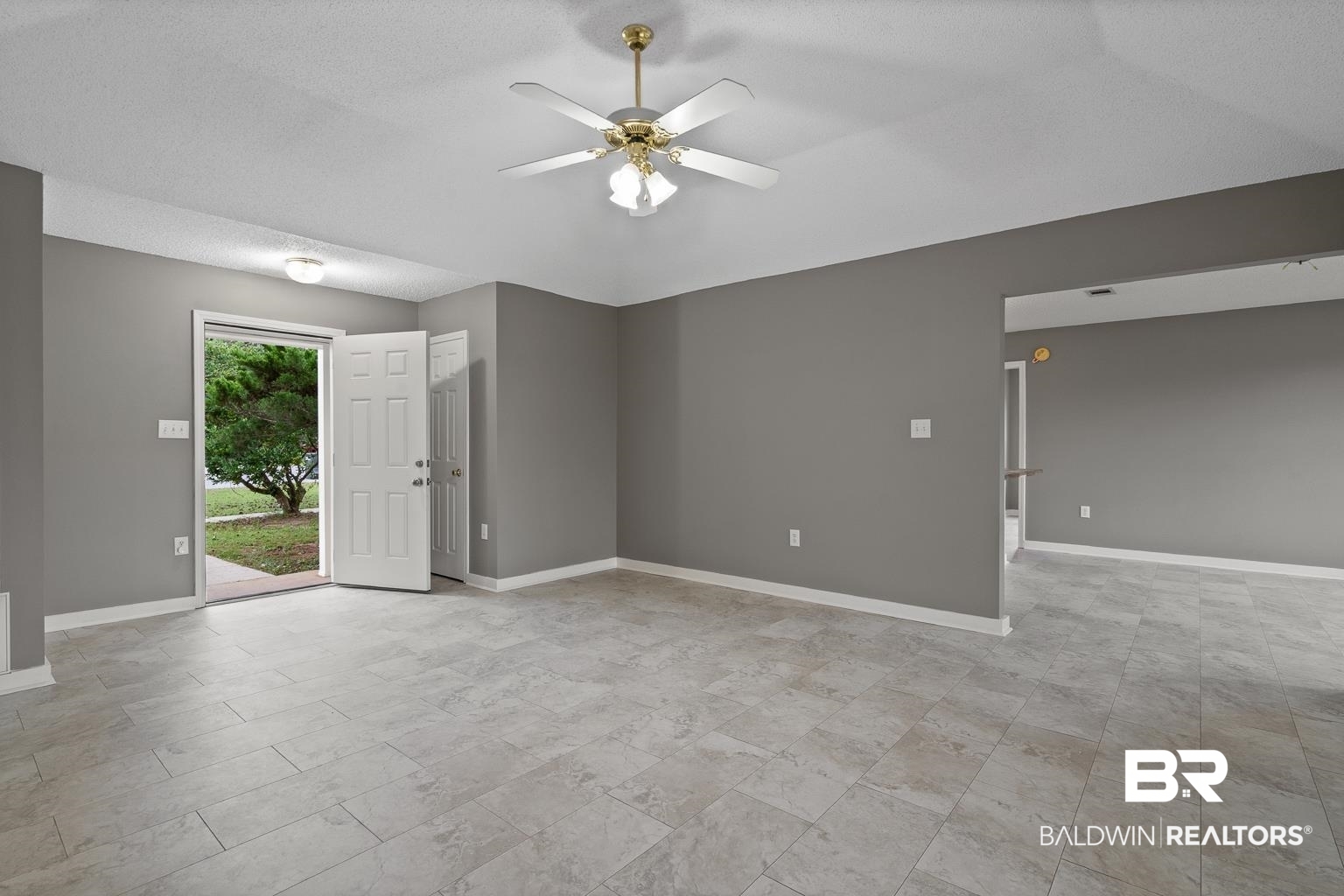 16418 Avent Lane Foley, AL 36535 - Photo 13 of 30 Spare room featuring ceiling fan and a textured ceiling