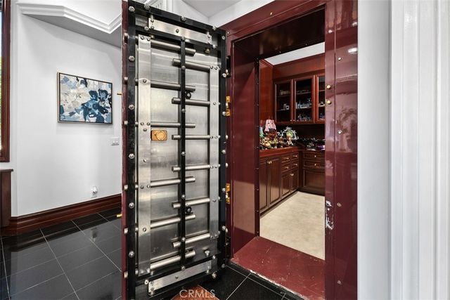 a front view of a house with large windows