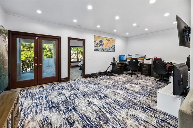 a bathroom with a granite countertop toilet sink and mirror