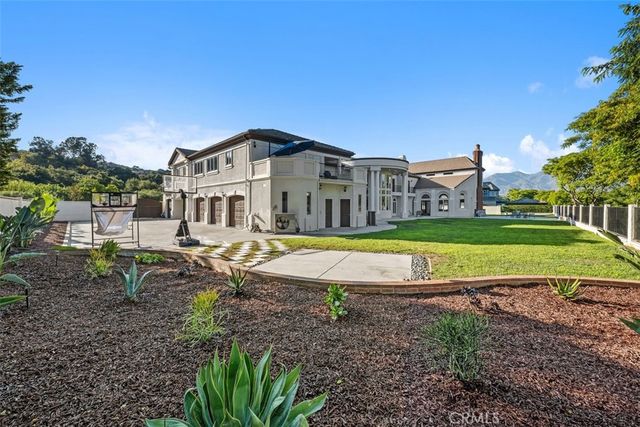 a bathroom with a granite countertop sink a toilet and a mirror