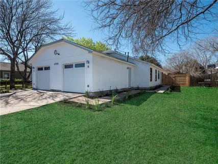 a house view with a garden space