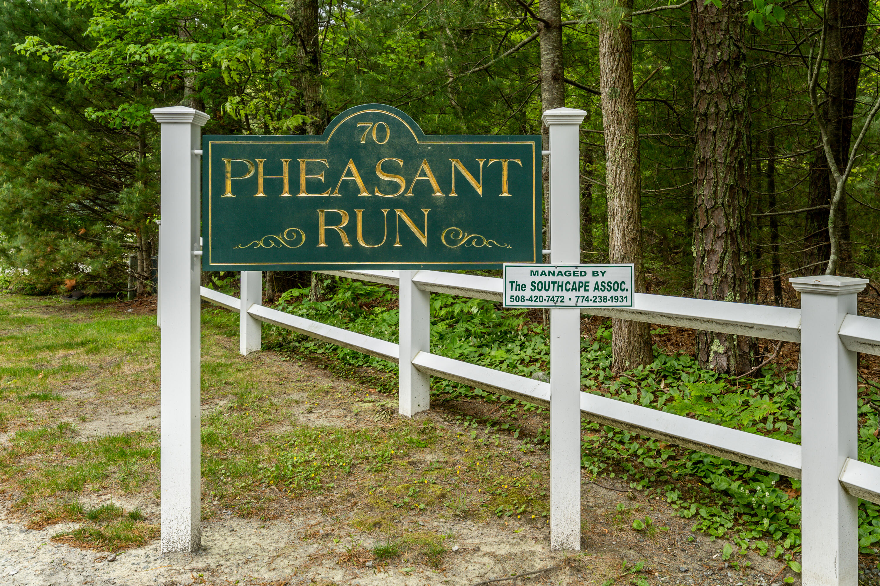 70 Cape Drive, Unit 12D Mashpee, MA 02649 - Photo 13 of 13 a view of a wooden fence of the house