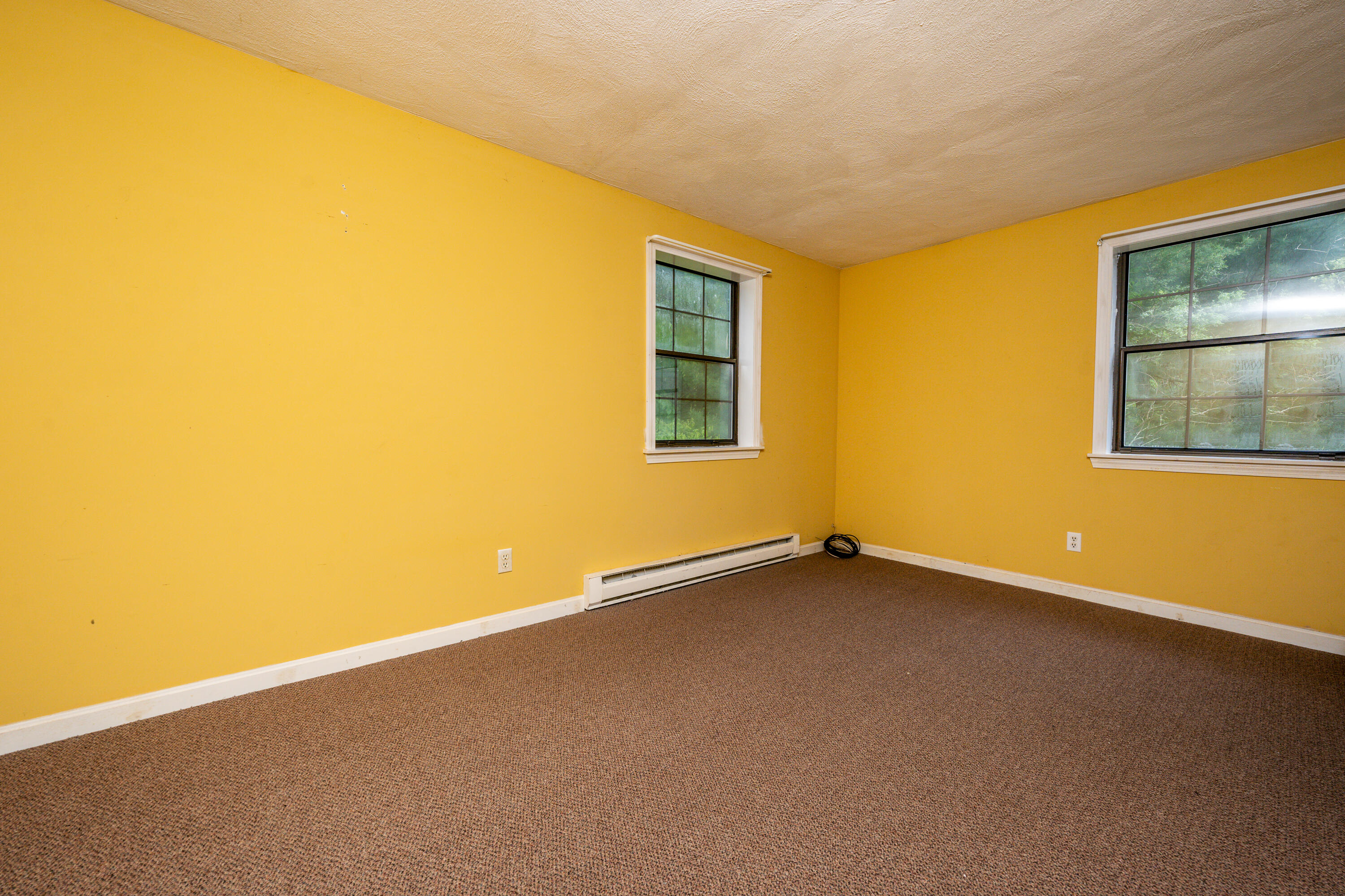 70 Cape Drive, Unit 12D Mashpee, MA 02649 - Photo 10 of 13 a view of an empty room with a window