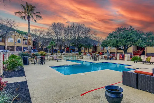 a view of swimming pool with outdoor seating