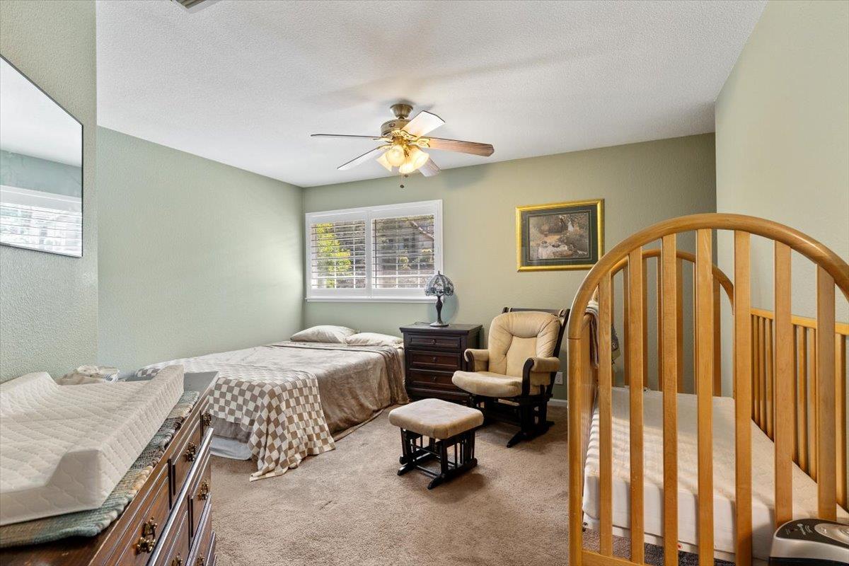 2565 Bertella Road Cameron Park, CA 95682 - Photo 12 of 31 a bedroom with a bed a couch and a window