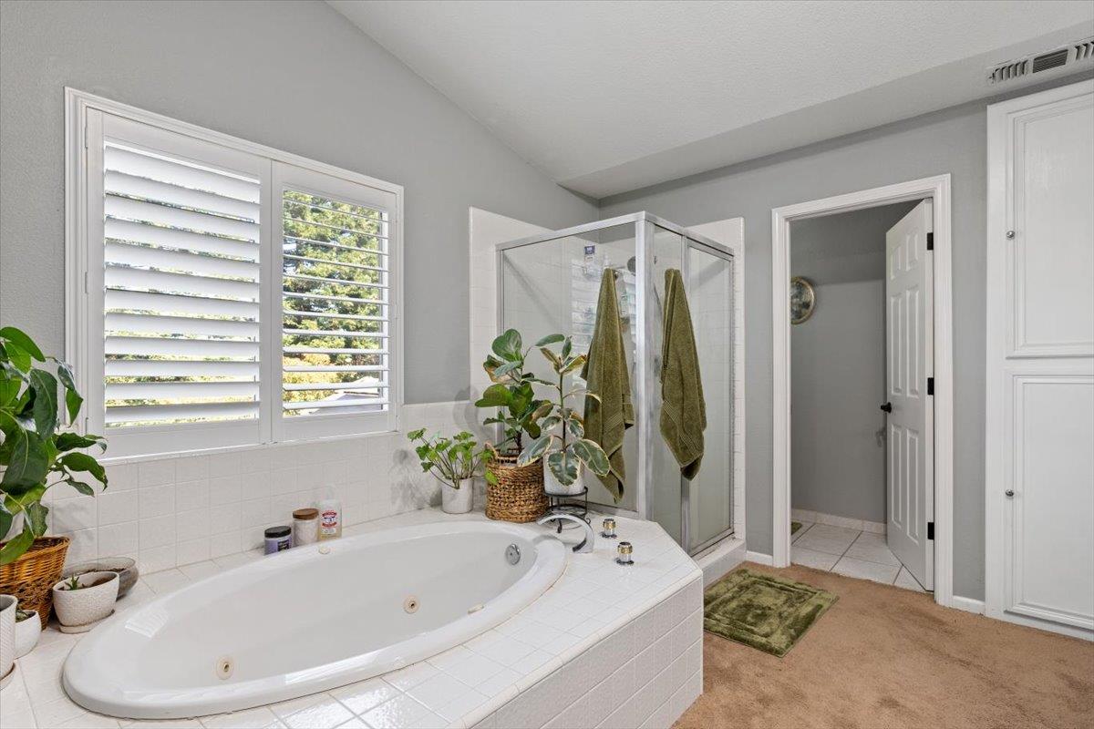 2565 Bertella Road Cameron Park, CA 95682 - Photo 16 of 31 a bathroom with a tub a sink and a window